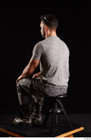  Larry Steel  1 boots dressed grey camo trousers grey t shirt shoes sitting whole body 0002.jpg